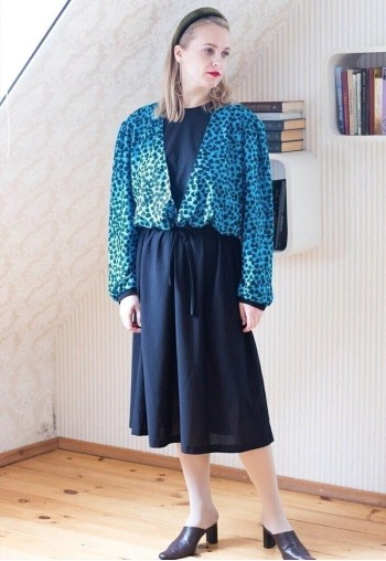 Black belted midi dress with blue patterned layer