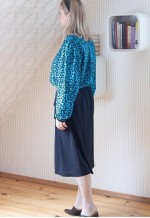 Black belted midi dress with blue patterned layer