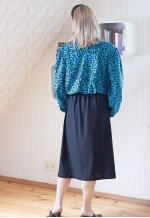 Black belted midi dress with blue patterned layer