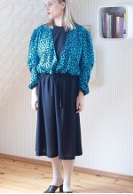 Black belted midi dress with blue patterned layer